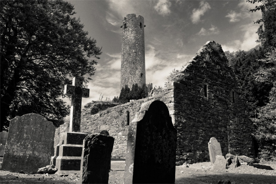 Black and white image of Kilree Church and Round Tower